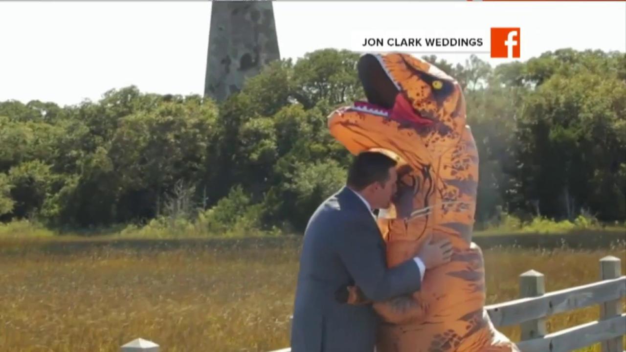 Watch this bride surprise her groom dressed as a T. rex
