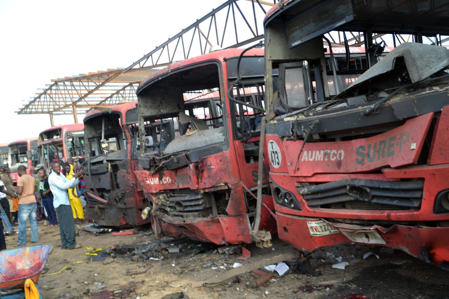 Image: Buses burnt after bombing in Abuja, Nigeria