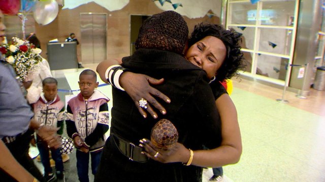 Image: Amira Ali embraces her daughter Tina at Denver airport after having been separated from each other for 24 years