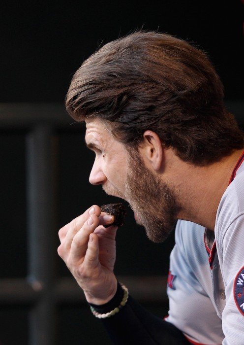 Image: Bryce Harper of the Washington Nationals puts chewing tobacco in his mouth
