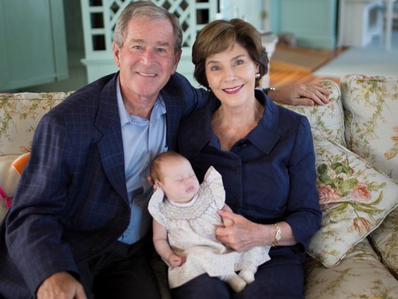 Jenna's parents, George W. Bush and Barbara Bush cuddle up with their new grandchild Mila.