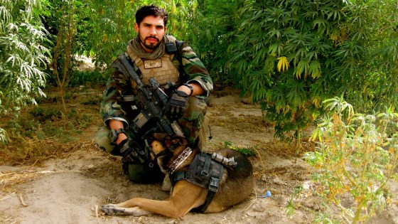 Staff Sgt. Christopher Diaz, pictured with Dino, his military dog. 