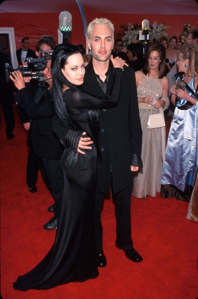 Actress Angelina Jolie, wearing black gown, and brother James Haven at Academy Awards.  (Photo by Mirek Towski/DMI/The LIFE Picture Collection/Getty I...