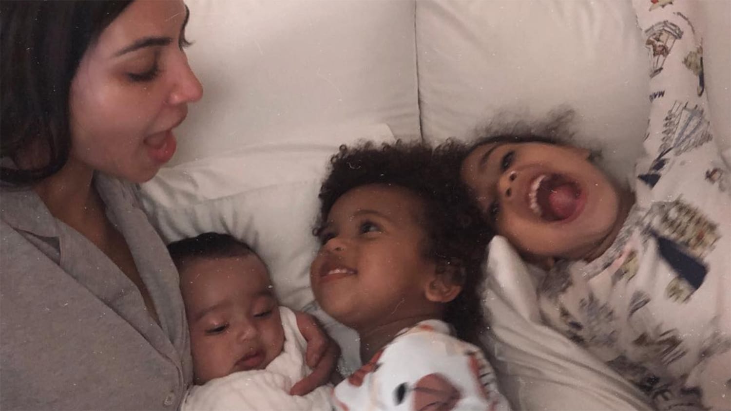 Kim Kardashian snuggles with baby Chicago, Saint and North ...