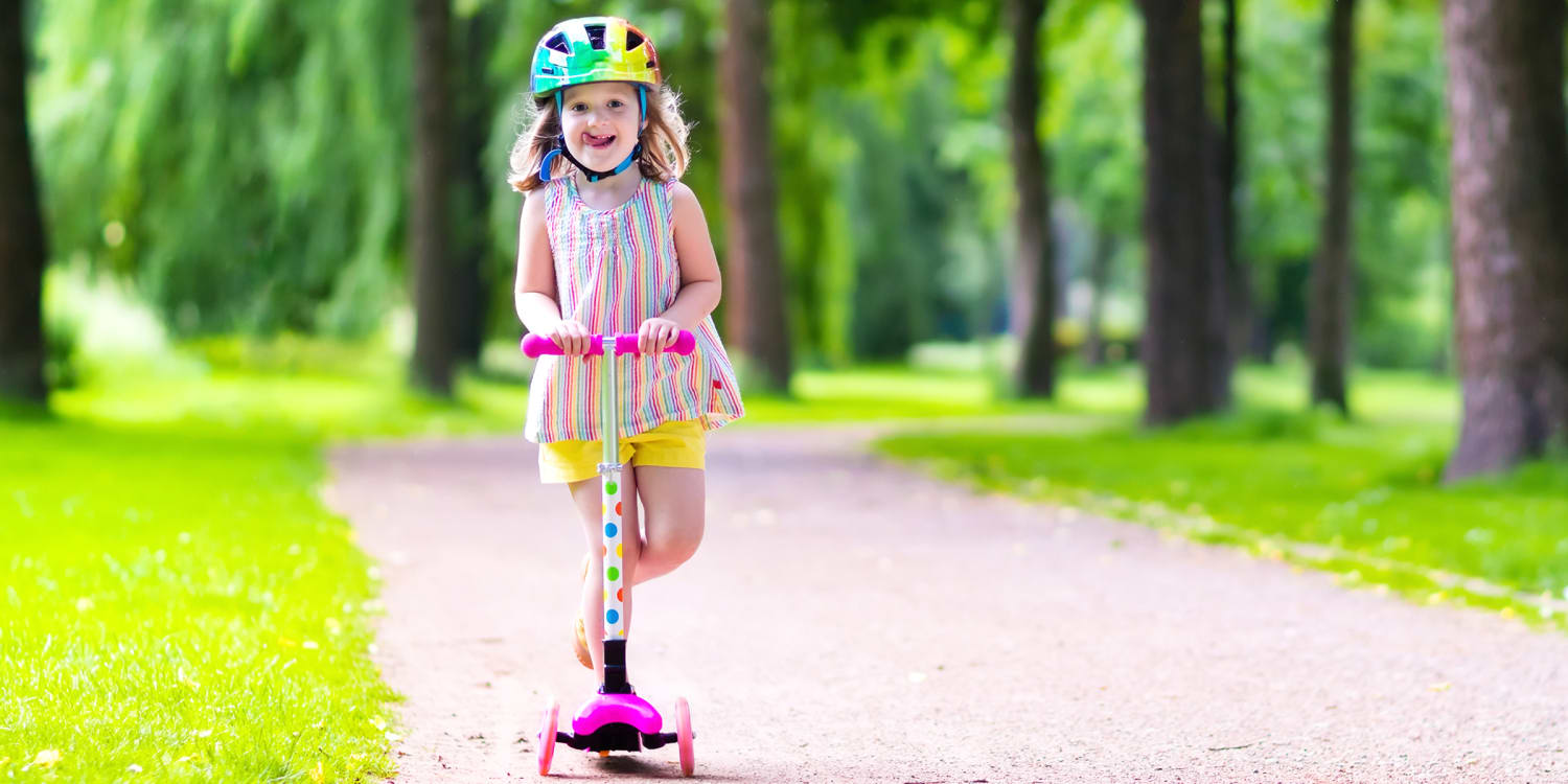 child riding scooter