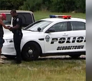 Photo of Cop Praying With Man Goes Viral