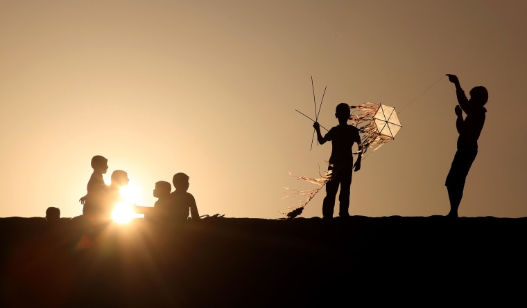 Kites Catch the Wind as Sun Sets on Refugee Camp