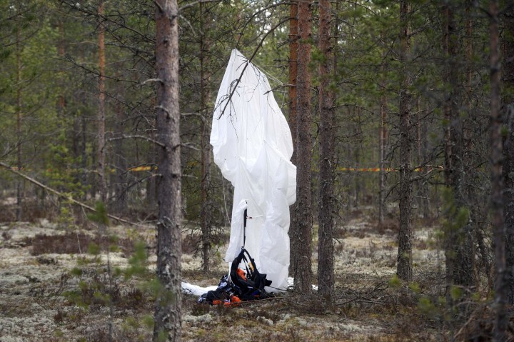 Image: A parachute hangs from a tree close to the wreckage of experimental aircraft Comp Air 8 next to Jamijarvi Airfield, southwest Finland