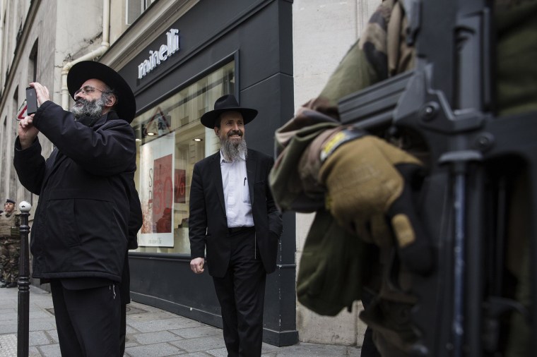 Image: Armed security forces stand outside a Jewish school in Paris on Monday