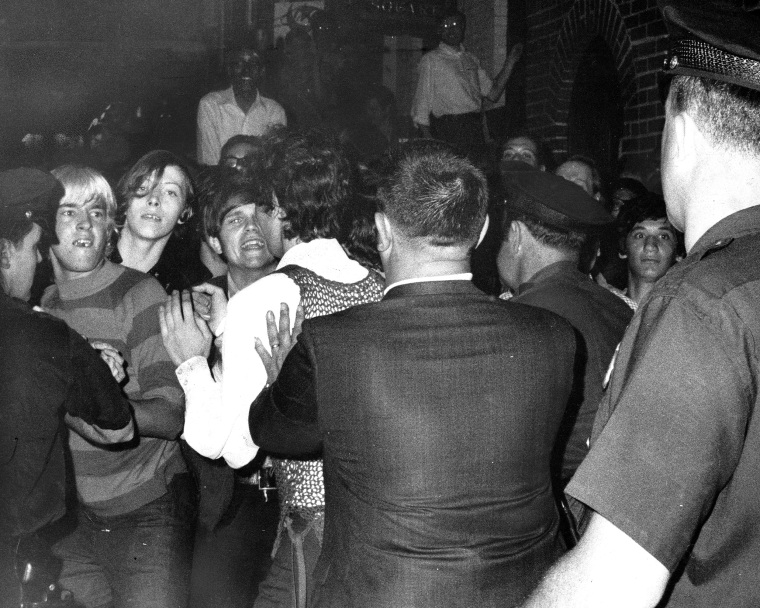 Stonewall Inn nightclub raid. Crowd attempts to impede polic