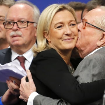 Image: French far-right Front National leader Marine Le Pen is kissed by her father Jean-Marie Le Pen