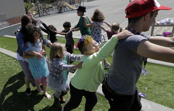 Image: campers and camp counselors dance at the Bay Area Rainbow Day Camp in El Cerrito, Calif.