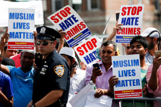 Image: Community members protest during the funeral service of Imam Maulama Akonjee, and Thara Uddin in the Queens borough of New York