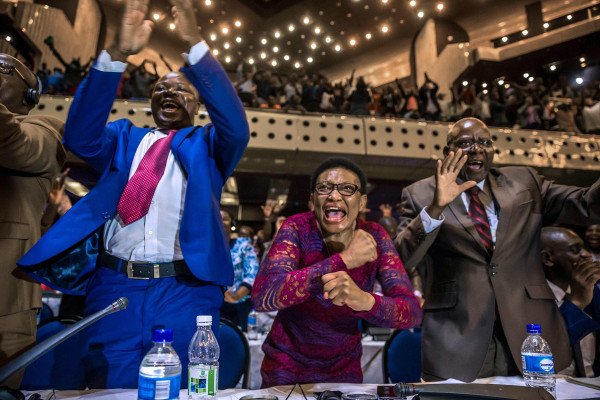 Image: Zimbabwe's members of parliament celebrate after Mugabe's resignation
