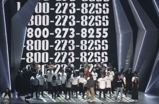 Image: Khalid, from left, Logic, and Alessia Cara perform "1-800-273-8255" at the MTV Video Music Awards