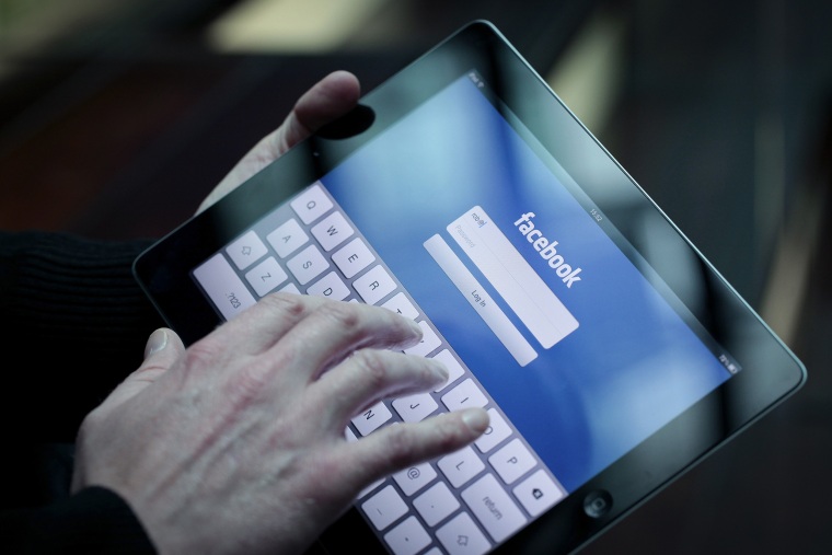 Image: A Facebook user logs into account