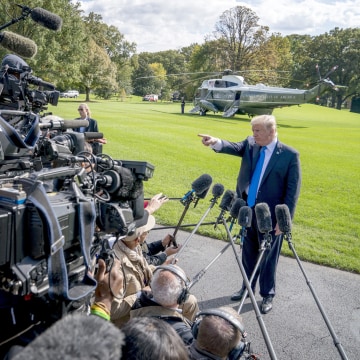 Image: President Donald Trump calls on a reporter before boarding Marine One on the South Lawn of the White House in Washington, on Oct. 25, 2017, for a short trip to Andrews Air Force Base, Maryland and then on to Dallas.
