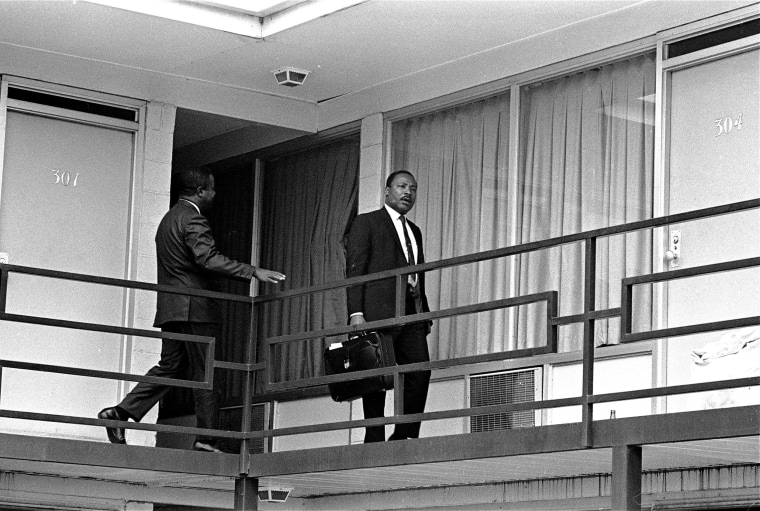 Image: Martin Luther King Jr. walking across the balcony of the Lorraine Motel in Memphis