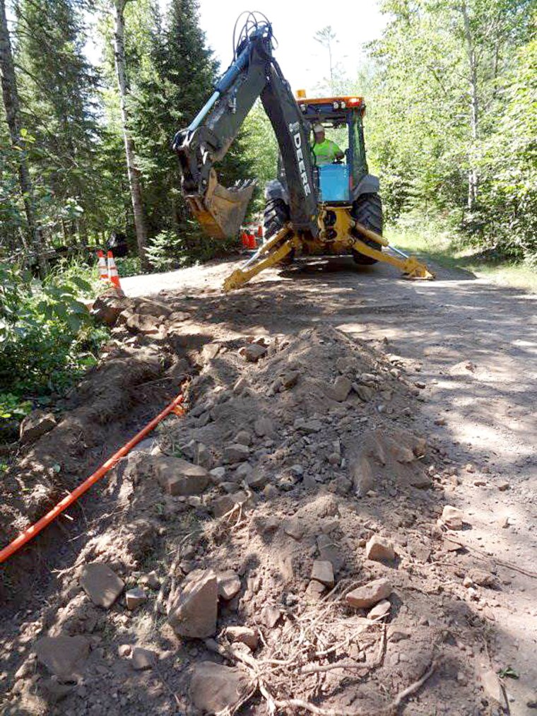 Image Lake Connections crew burying fiber underground in Blueberry Hill Minnesota