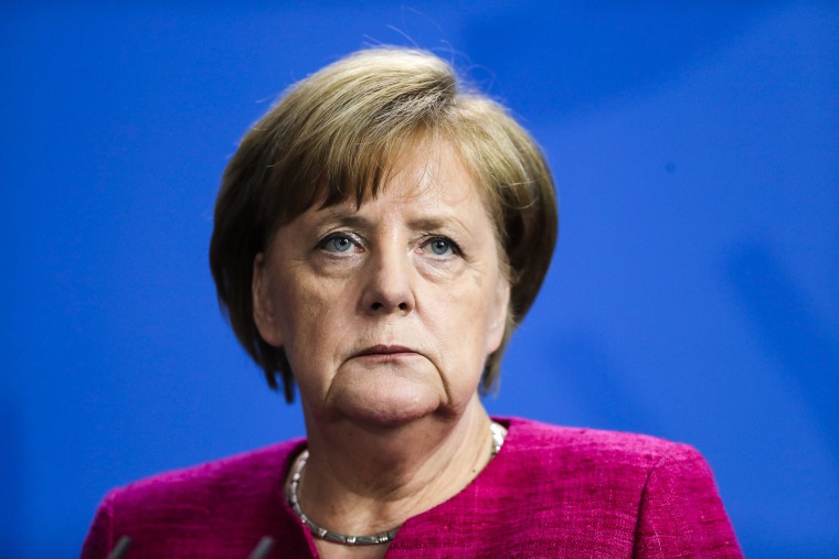Image: German Chancellor Angela Merkel attends a news conference