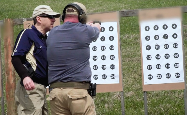 Image: A teacher learns to use a firearm in Newcomerstown, Ohio