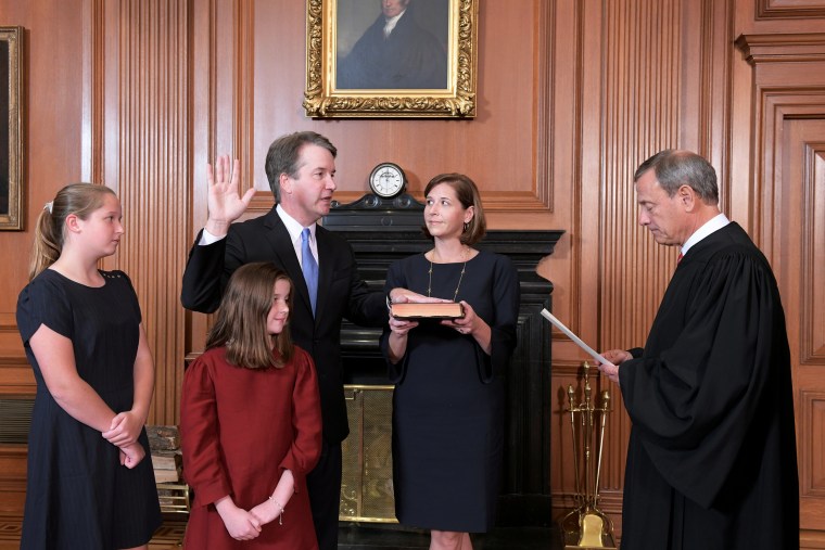 Image: Judge Brett Kavanaugh is sworn in as an Associate Justice of the U.S. Supreme Court by Chief Justice John Roberts at the Supreme Court in Washington