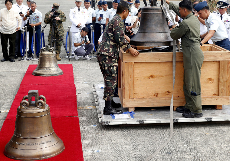 Image: Philippine military personnel unload the three church bells