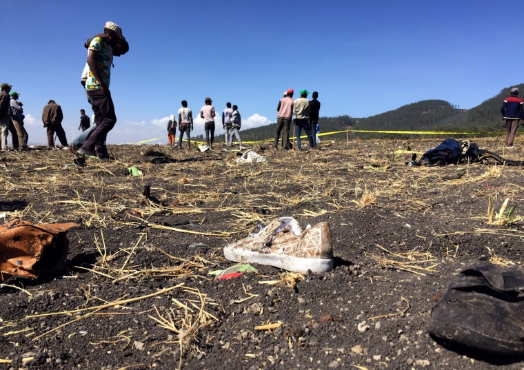 Image: People look at the scene of the Ethiopian Airlines crash near the town of Bishoftu, southeast of Addis Ababa, on March 10, 2019.