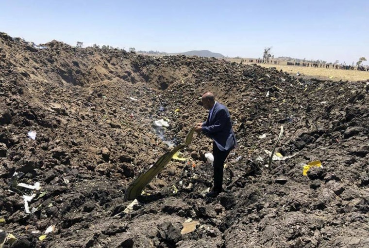 Image: Tewolde Gebremariam, the CEO of Ethiopian Airlines, looks at the wreckage of a plane that crashed after takeoff from Addis Ababa on March 10, 2019. The crash killed all 157 people on board.