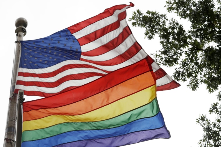 Image: The rainbow flag flies beneath the American flag