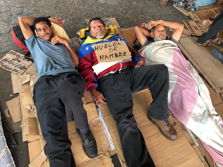 Dozens of former oil workers are staging a hunger strike in Caracas.