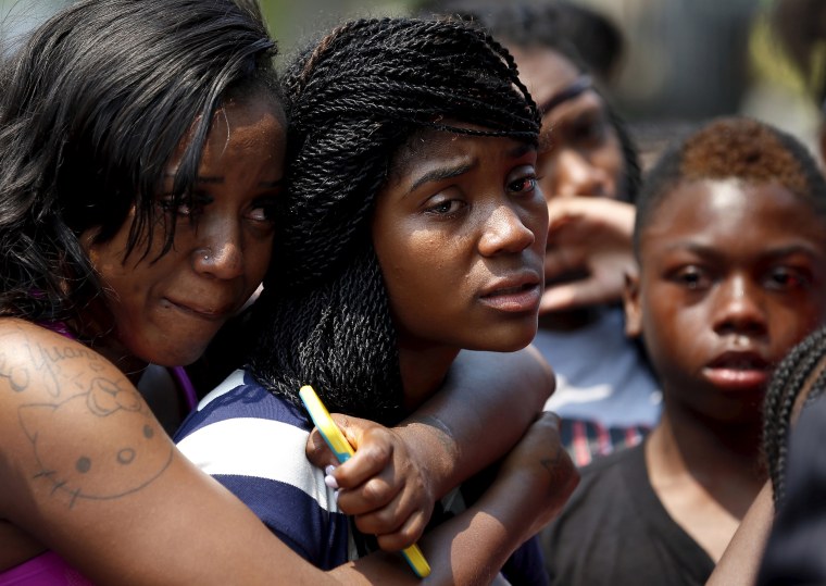 Mourners grieve for 7-year-old Amari Brown who was shot and killed in Chicago on July 5, 2015.