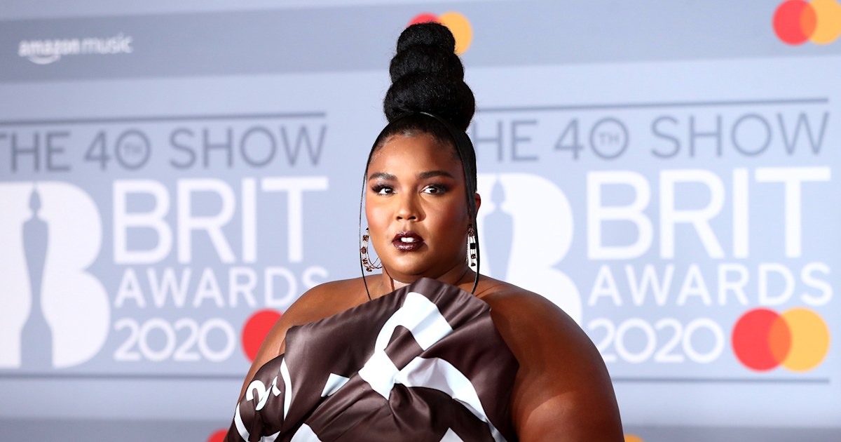 Lizzo dresses like a Hershey's bar for her latest red carpet event...