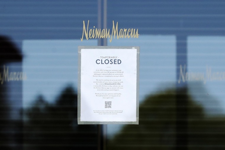 Image: A temporary closed sign shows at the Neiman Marcus department store in Northbrook, Ill