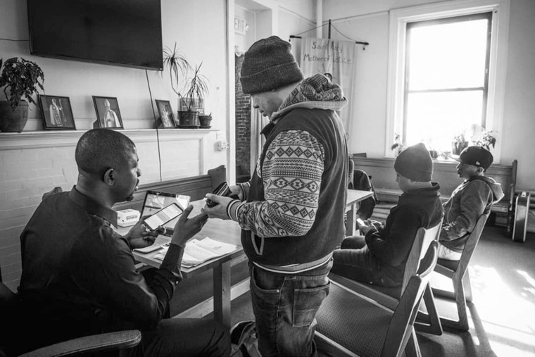 Image: Edafe Okporo and Juan, a guest at the shelter for asylum seekers in New York City.