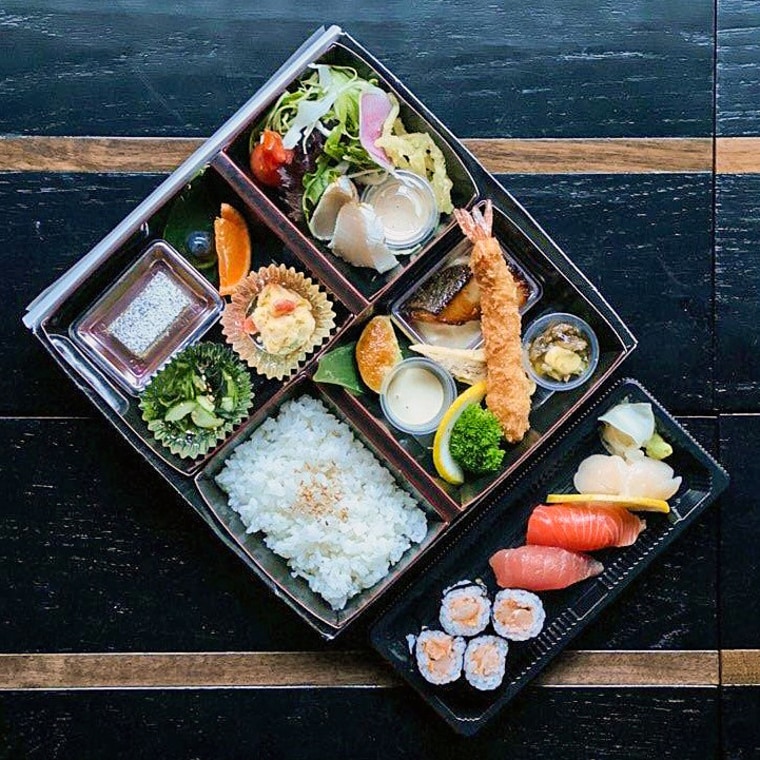 Restaurant n-naka's bento box with sushi.