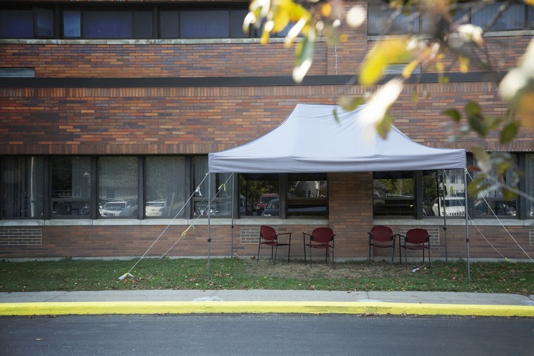 A tent is set up near the windows where visitors can see residents at the Premier Genesee Center for Nursing and Rehabilitation in Batavia, N.Y., on Oct. 9.