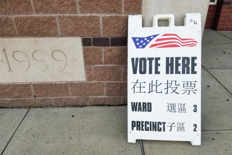 A sign in Chinese and English outside a voting station in Malden, Massachusetts on Election Day, November 3, 2020. Malden qualifies for bilingual voting materials under federal law because of its large Chinese-speaking population.