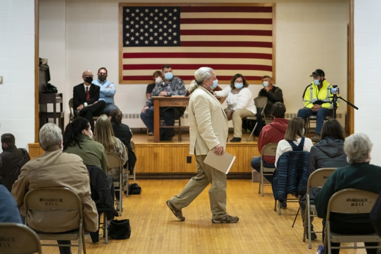 Lawyer and member of the Asatru Folk Assembly Allen Turnage returns to his seat, Wednesday, Oct. 14, 2020, in Murdock, Minn., after taking questions from the public.