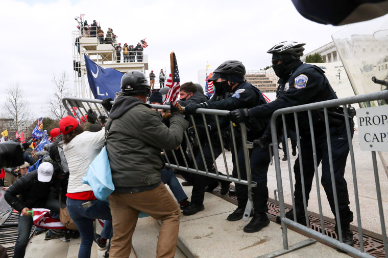 Image: Supporters of President Donald Trump clash with police officers outside of the Capitol on Jan. 6, 2021.