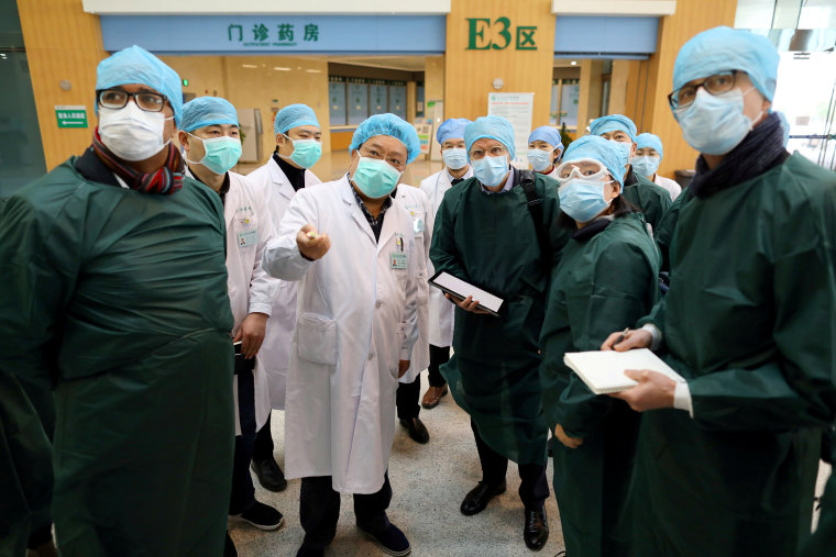 Image: Experts from China and the World Health Organization joint team visit the Wuhan Tongji Hospital in Wuhan.